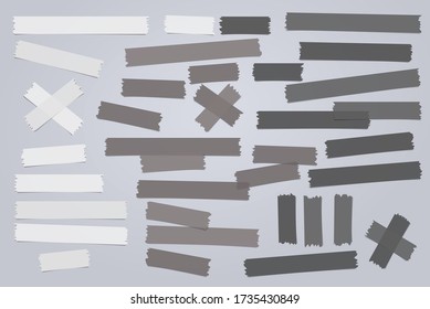 White, black different size adhesive, sticky, masking, duct tape, paper pieces are on white squared background