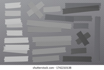White and black different size adhesive, sticky, masking, duct tape, paper pieces are on dark squared background