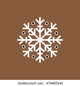 White and black winter snowflake on brown background. End of year christmas and sale season.
