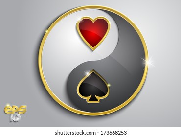 White and black yin yang sign with red and black card suits on a gray background