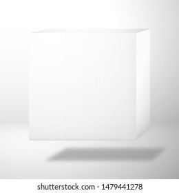 A white blank cubic box is above the surface. Mockup for design with shadow