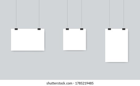 White blank paper poster template hanging on wall. Isolated set of empty sheet in horizontal, vertical and square style. A4 banner template with clips and rope. Vector EPS 10.