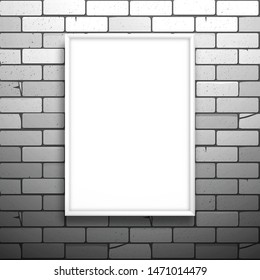 White blank picture frame hanging on the brick wall. Mockup for design with shadow