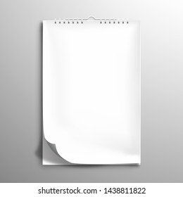 White blank spiral notebook, album or calendar. The edge of the top sheet is bent. Mockup with shadows