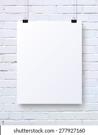 White blank vertical poster mock-up on the white brick wall, vector illustration