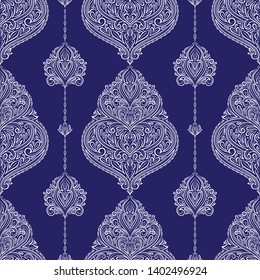 White and blue floral seamless pattern with ornamental stripes. Traditional oriental motifs. Vintage ornament template. Decorative paisley elements. Great for fabric and textile.