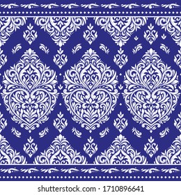 White and blue floral seamless pattern with ornamental stripes. Traditional oriental motifs. Vintage ornament template. Decorative paisley elements. Great for fabric and textile.