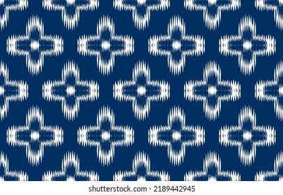 white and blue ikat ethnic design
 background. Seamless ikat floral pattern in tribal, folk embroidery abstract art. art ornament print.Design for carpet, wallpaper, clothing, wrapping, fabric fashion