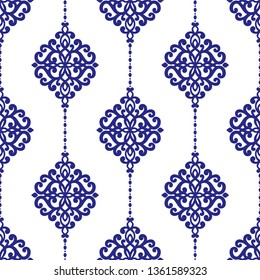 White and blue vintage seamless pattern with ornamental stripes. Traditional oriental motifs. Ornament template. Decorative paisley elements. Great for fabric and textile.