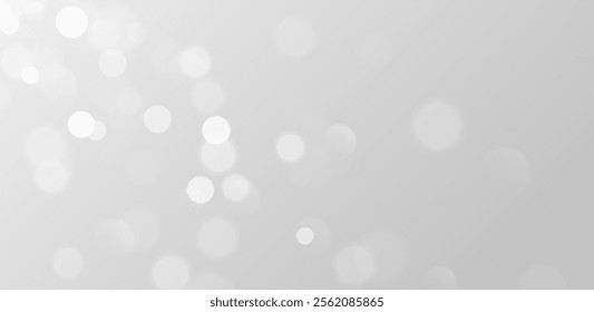 White bokeh, blurred grey background with sparkling lights, blurry glitter effect.