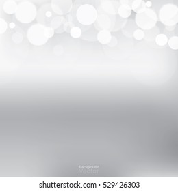 White bokeh on gradient light gray background