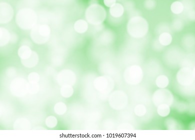 White bokeh on green background vector