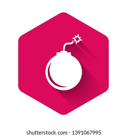 White Bomb ready to explode icon isolated with long shadow. Pink hexagon button. Vector Illustration