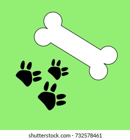 White bone with three dog tracks in black color on a green background. vector, illustration.