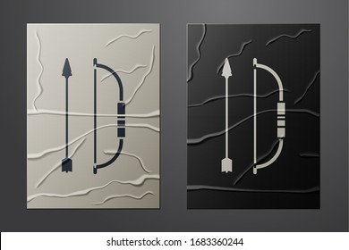 White Bow and arrow in quiver icon isolated on crumpled paper background. Paper art style. Vector Illustration