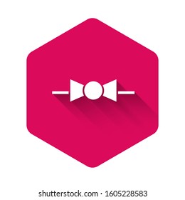 White Bow tie icon isolated with long shadow. Pink hexagon button. Vector Illustration