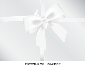 White bow tied using silk ribbon, cut out top view