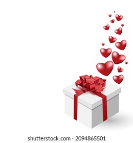 A white box with a red bow and flying hearts. Three-dimensional realistic festive vector illustration. For printing,postcards,banners,wallpapers,designs for Valentine's Day,birthday