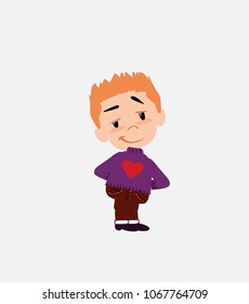 White boy with a heart pullover smiling peacefully.																									