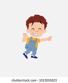 White boy in jeans pointing to something funny on his left.																									