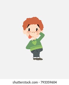 White boy in jeans sticks out his tongue in gesture of funny shyness.																									