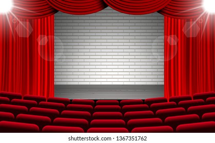 white brick wall on the stage with red chairs in the hall