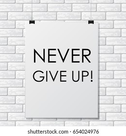 White brick wall with poster and motivation text