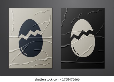 White Broken egg icon isolated on crumpled paper background. Happy Easter. Paper art style. Vector Illustration