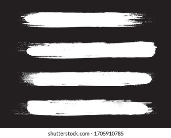 White brush stroke set isolated on black background. Trendy brush stroke vector for white ink paint, grunge backdrop, dirt banner, watercolor design and dirty texture. Brush stroke vector illustration