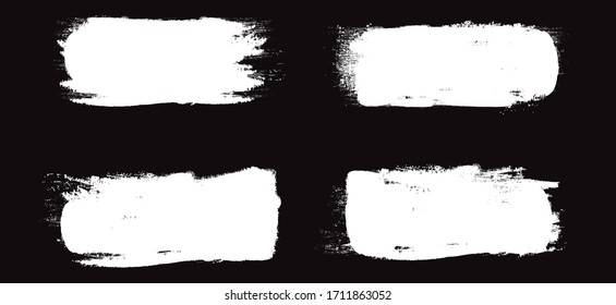 White brush stroke set isolated on black background. Trendy brush stroke vector for white ink paint, grunge backdrop, dirt banner, watercolor design and dirty texture. Brush stroke vector illustration