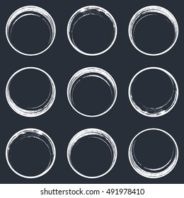 White brush strokes circle buttons web design collection. Abstract grunge handmade round design elements isolated on gray background.