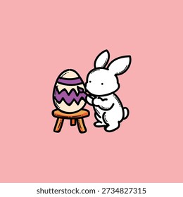 A white bunny decorates a cracked Easter egg with a purple zigzag pattern on a tiny wooden stool, set against a warm pink backdrop. A playful, family-friendly spring craft scene.