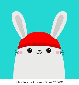 White bunny rabbit hare head face. Red hat. Merry Christmas. Happy New Year. Greeting card. Cute cartoon kawaii baby character. Funny animal. Flat design. Hello winter. Blue background. Vector