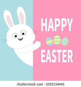 White bunny rabbit holding big signboard. Cute cartoon funny animal hiding behind paper. Happy Easter. Lettering text. Painting egg. Flat design. Typography print Pastel background Vector illustration