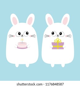 White bunny rabbit holding gift box, cake. Funny head face. Big eyes. Cute kawaii cartoon character. Baby greeting card template. Happy Birthday sign symbol. Blue background. Flat design. Vector