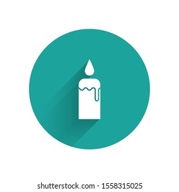 White Burning candle in candlestick icon isolated with long shadow. Cylindrical candle stick with burning flame. Green circle button. Vector Illustration