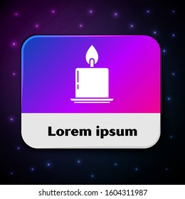 White Burning candle in candlestick icon isolated on black background. Cylindrical candle stick with burning flame. Rectangle color button. Vector Illustration