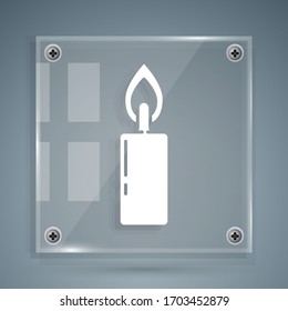 White Burning candle icon isolated on grey background. Cylindrical candle stick with burning flame. Square glass panels. Vector Illustration