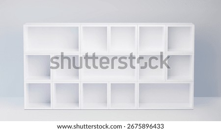 White cabinet with with mixed size empty compartments - modern shelf unit for flexible storage solutions. Scandinavian style organizer unit for books, decor or office supplies display.