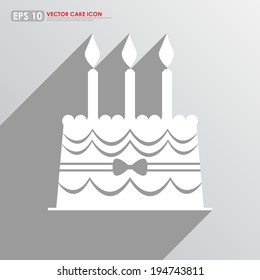 White cake icon on gray background - birthday and celebration concept