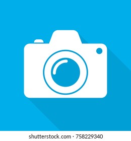 White camera icon in flat design. Vector illustration. Camera icon with long shadow on blue background.