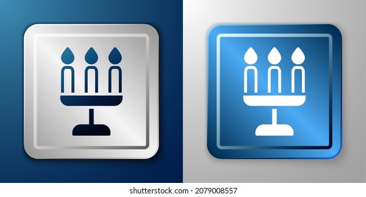 White Candelabrum with three candlesticks icon isolated on blue and grey background. Silver and blue square button. Vector