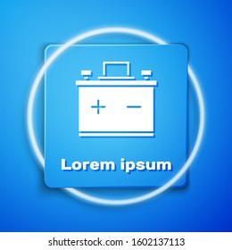 White Car battery icon isolated on blue background. Accumulator battery energy power and electricity accumulator battery. Blue square button. Vector Illustration