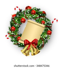 White card with Christmas wreath and bow and bells isolated on wood background with gingerbread