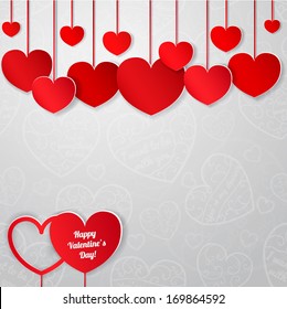 White card for Valentine's Day with red paper hearts