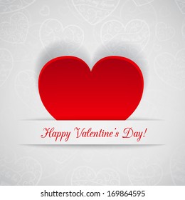 White card for Valentine's Day with red paper heart