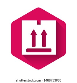 White Cardboard box with traffic symbol icon isolated with long shadow. Box, package, parcel sign. Delivery, transportation and shipping. Pink hexagon button. Vector Illustration