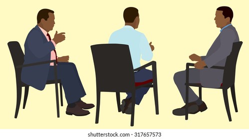 White or Caucasian American Businessman Sitting in Chairs Having a Meeting