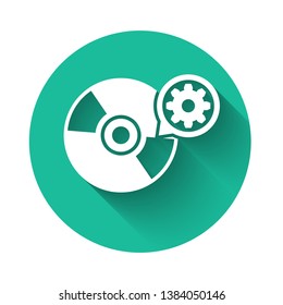 White CD or DVD disk and gear icon isolated with long shadow. Adjusting app, service concept, setting options, maintenance, repair, fixing. Green circle button. Vector Illustration