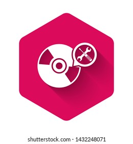 White CD or DVD disk with screwdriver and wrench icon isolated with long shadow. Adjusting, service, setting, maintenance, repair, fixing. Pink hexagon button. Vector Illustration
